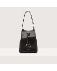 Coccinelle - Cowhide Leather Bucket Bag Roundabout Cowhide Medium - Lyst