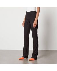 De La Vali - Elena Crepe Flared Trousers - Lyst