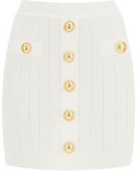 Balmain - Knit Mini Skirt With Embossed Buttons - Lyst