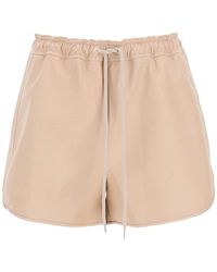 Shorts in similpelle di Stella McCartney in Neutro Donna Abbigliamento da Shorts da Mini shorts 