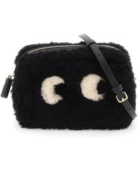 Anya Hindmarch Shearling Mini Eyes Crossbody Bag in Black | Lyst