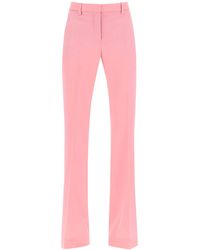 Versace - Low Waisted Flared Trousers - Lyst