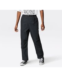 pantalones de vestir y chinos de Pantalones informales Hombre Ropa de Pantalones Camiseta Cons con logo estampado Converse de hombre de color Negro 