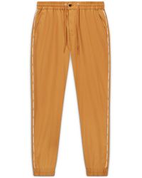sweatpants with high top converse