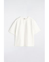 COS - Oversized Cotton-Jersey Henley T-Shirt - Lyst