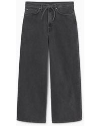 COS - Extra Wide-leg Drawstring Denim Trousers - Lyst