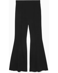 COS - Pintucked Flared Trousers - Lyst