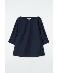 COS - Voluminous Boat-neck Cotton Blouse In Navy - Lyst