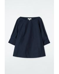 COS - Voluminous Boat-neck Cotton Blouse In Navy - Lyst