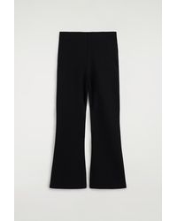 COS - Jersey Flared Trousers - Lyst