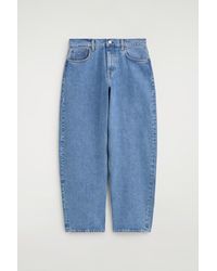 COS - Inlet Curved-Leg Jeans - Lyst