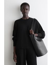 COS - Pullover Aus Merinowolle Mit Rundhalsausschnitt - Lyst