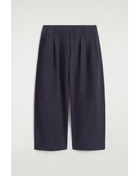 COS - Pleated Cotton Balloon-Leg Trousers - Lyst