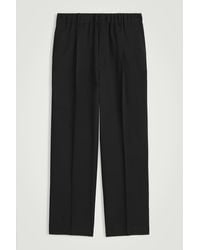 COS - Wool-Twill Pleated Elasticated Trousers - Lyst