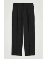COS - Wool-Twill Pleated Elasticated Trousers - Lyst