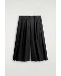 COS - Pleated Cotton Pants - Lyst