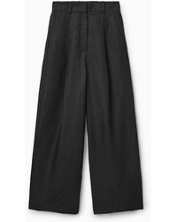 COS High Waisted Pleated Trousers in Natural | Lyst