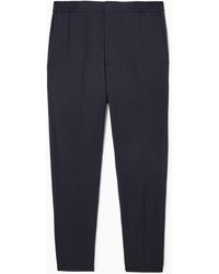 COS - Tapered Elasticated Wool-twill Pants - Lyst