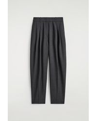 COS - Pleated Wool-Blend Barrel-Leg Trousers - Lyst
