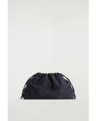 COS - Cavatelli Clutch Bag - Lyst