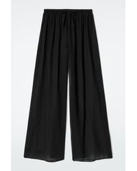 COS - Crinkled Cotton Beach Trousers - Lyst
