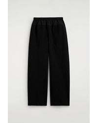COS - Poplin-Panelled Jersey Trousers - Lyst