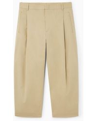 COS - Pleated Tapered Pants - Lyst