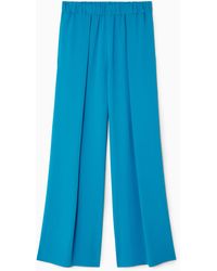COS - Pleated Elasticated Wide-leg Trousers - Lyst