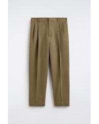 COS - Pleated Relaxed-Fit Tapered Trousers - Lyst