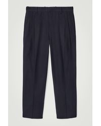 COS - Lockere, Schmal Zulaufende Baumwollhose Mit Falten - Lyst