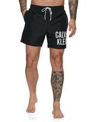 en zwemshorts Calvin Klein Medium Runner Zwembroek in het Zwart voor heren Heren Kleding voor voor Strandkleding voor Board 