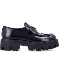 Prada - Brushed Leather Loafers With Enameled Triangle Logo And 50 Mm Monoblock Rubber Sole - Lyst