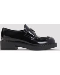 Prada - Calf Leather & Rubber Slip-On Loafers With Signature Print Motif (Fall/Winter 2026) - Lyst
