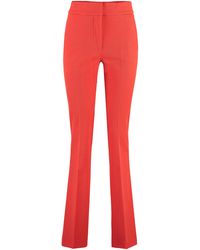 Genny - Flared Trousers - Lyst