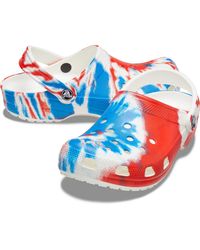 blue and white tie dye crocs