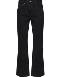 KHAITE - Cotton Denim Clara Flared Cropped Jeans - Lyst