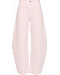 Alaïa - Dyed Cotton Denim Low-Rise Round Jeans - Lyst