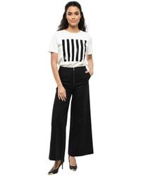 TOTEME - Flared Flat Front Pant - Lyst