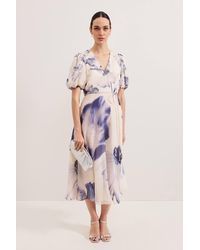 Phase Eight - Lizzie V-Neck Puff Sleeve Midi Dress - Lyst