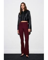 Dilvin - High-Waist Flare Leggings With Button Hem Detail - Lyst