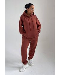 Femme Luxe - Oversized Front Pocket Pullover Hoodie Cuffed Joggers Loungewear Set - Lyst