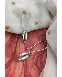 The Colourful Aura - Long Cowrie Sea Shell Charm Dangle Earrings - Lyst
