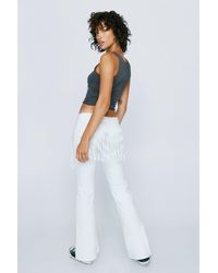 Nasty Gal - Petite Low Rise Denim Flared Jeans - Lyst