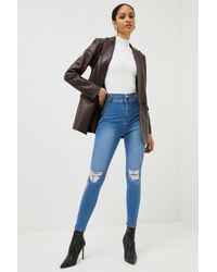 Karen Millen - Petite Button Tab Waist Ripped Skinny Jeans - Lyst