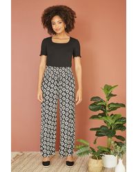 Yumi' - Black Geo Print Relaxed Fit Trousers - Lyst