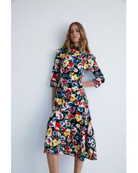 Warehouse - Petite Floral Ruffle Flippy Mini Dress - Lyst