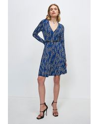 Karen Millen - Linear Geo Printed Jersey Belted Wrap Dress - Lyst