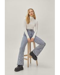 Nasty Gal - Star Applique High Waisted Flared Jeans - Lyst