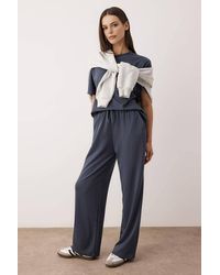 WOVCOR - 2-Piece Short Sleeve Crew Neck Relaxed Fit Stretch Knit Top Pants Set - Lyst
