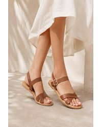 LARANGE - Cross Strap Buckle Flat Sandals - Lyst